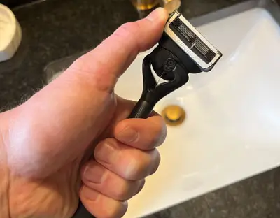 Hand holding the Gillette Intimate razor