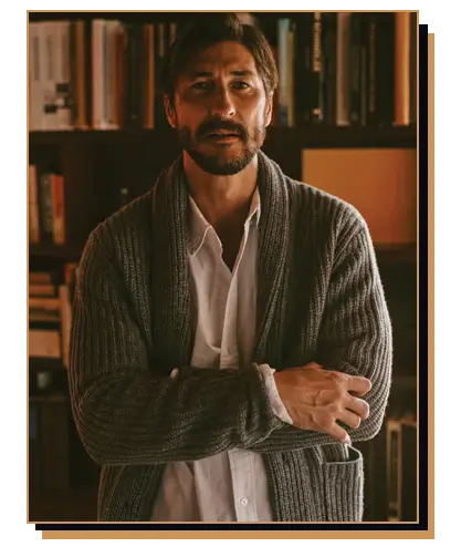 Man wearing shawl collar cardigan with button up shirt