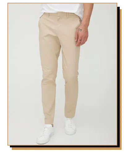 Man wearing khakis and white sneakers