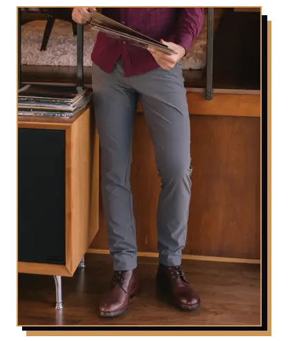 Man wearing grey pants and burgundy shirt