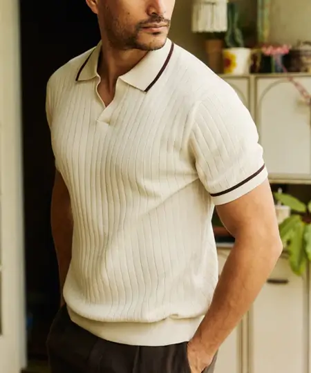 Man wearing an Old Money style ribbed, cream colored polo