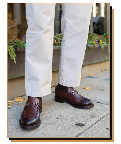 Man wearing dark brown horsebit loafers