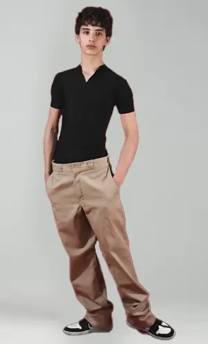 A man wearing a black t-shirt and baggy pants