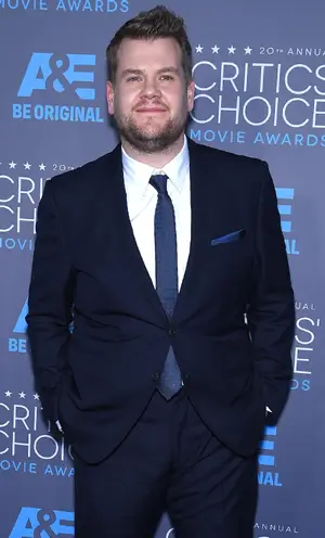 Promotional image of James Corden on a red carpet