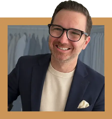Dave-Bowden-Irreverent-Gent-Founder Dave Bowden, founder and chief editor of Irreverent Gent, wearing a navy blazer, cream sweater, and glasses.
