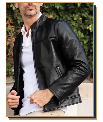 Man wearing a sleek black leather cafรฉ racer jacket layered over a crisp white polo shirt outdoors.